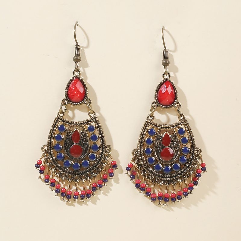Boucles d'oreilles bohèmes à pompon turquoise avec style ethnique minoritaire, boucles d'oreilles pour femmes personnalisées et élégantes_voghion.com