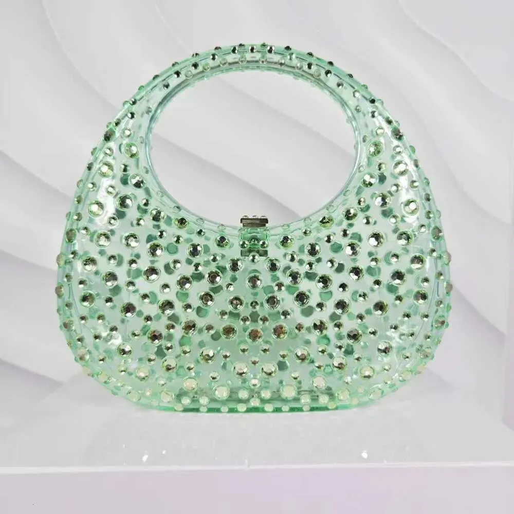Borsa da sera da donna in acrilico trasparente lucido con motivo a mezzaluna tempestato di diamanti e strass_voghion.com
