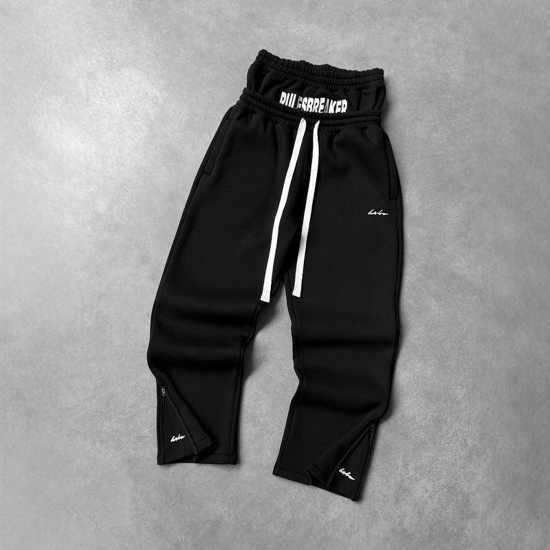 Pantalon streetwear unisexe ample en polyester imprimé – Pantalon long taille basse tendance avec poches pour une tenue décontractée_voghion.com