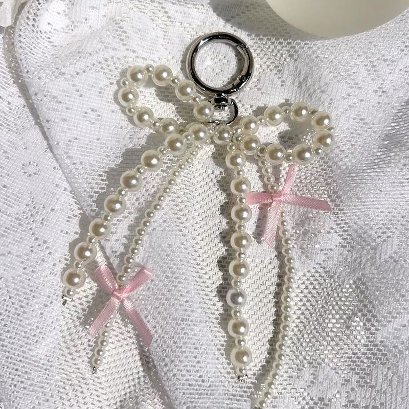 Portachiavi con catena per telefono e fiocco in stile coreano, con design a forma di ragazza rosa_voghion.com