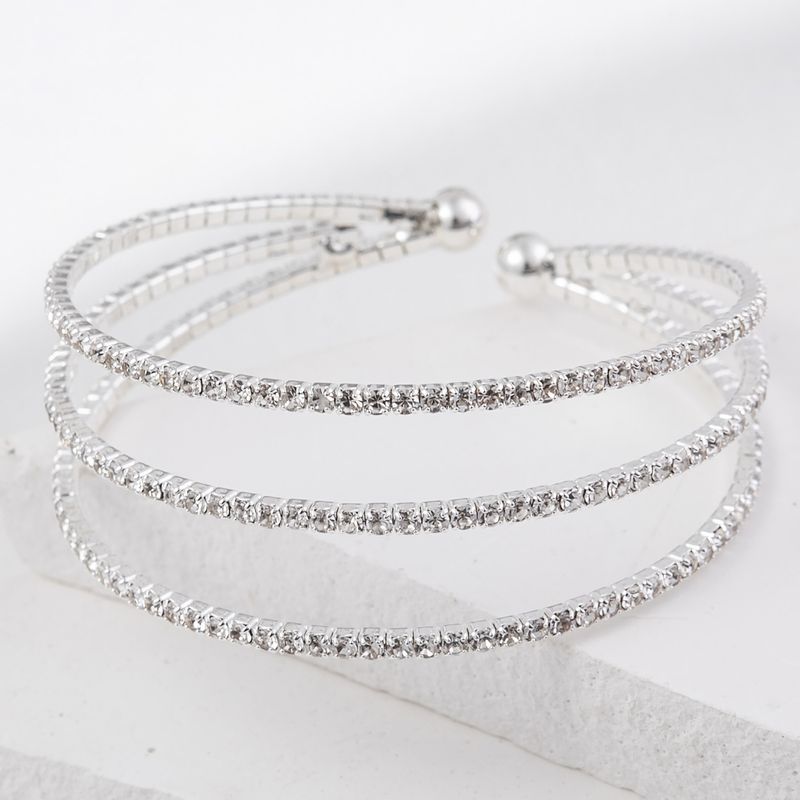 Bracciale aperto con 3 file di strass in filo d'acciaio elastico da donna, semplice, multistrato, con catena a griffe, leggero, lussuoso, gioiello da donna_voghion.com