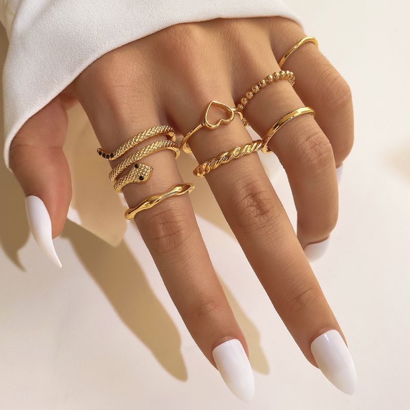 Anillo apilado retro étnico bohemio para mujer, anillo de aleación con giro simple, anillo de amor creativo retro multicapa con forma de serpiente y diamantes incrustados._voghion.com