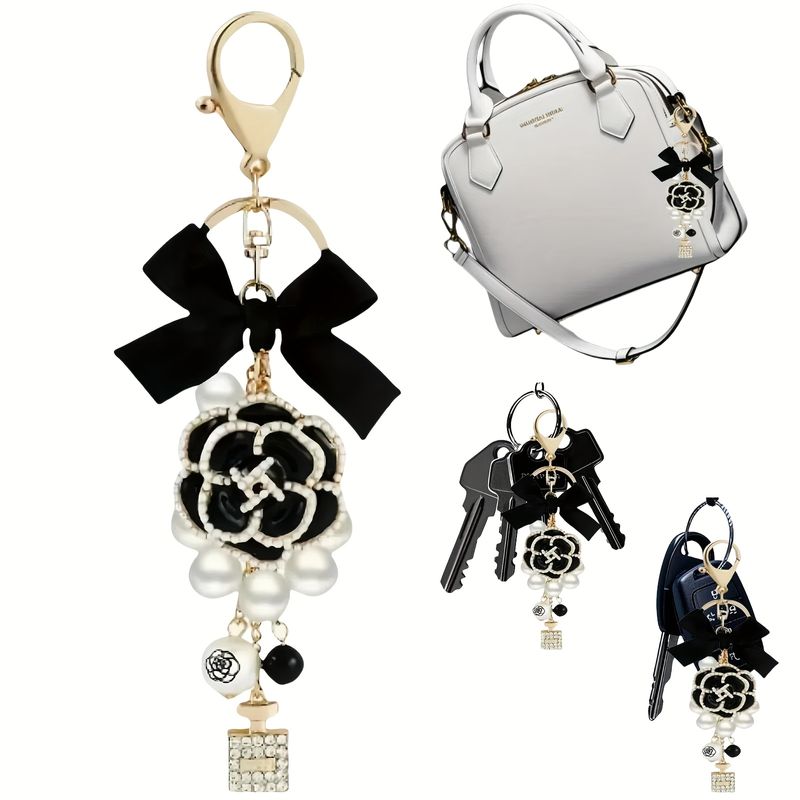 Elegante pochette in pelle nera con ciondolo a forma di fiocco di perle - Pochette da donna alla moda con portachiavi a forma di fiocco, accessori per auto_voghion.com