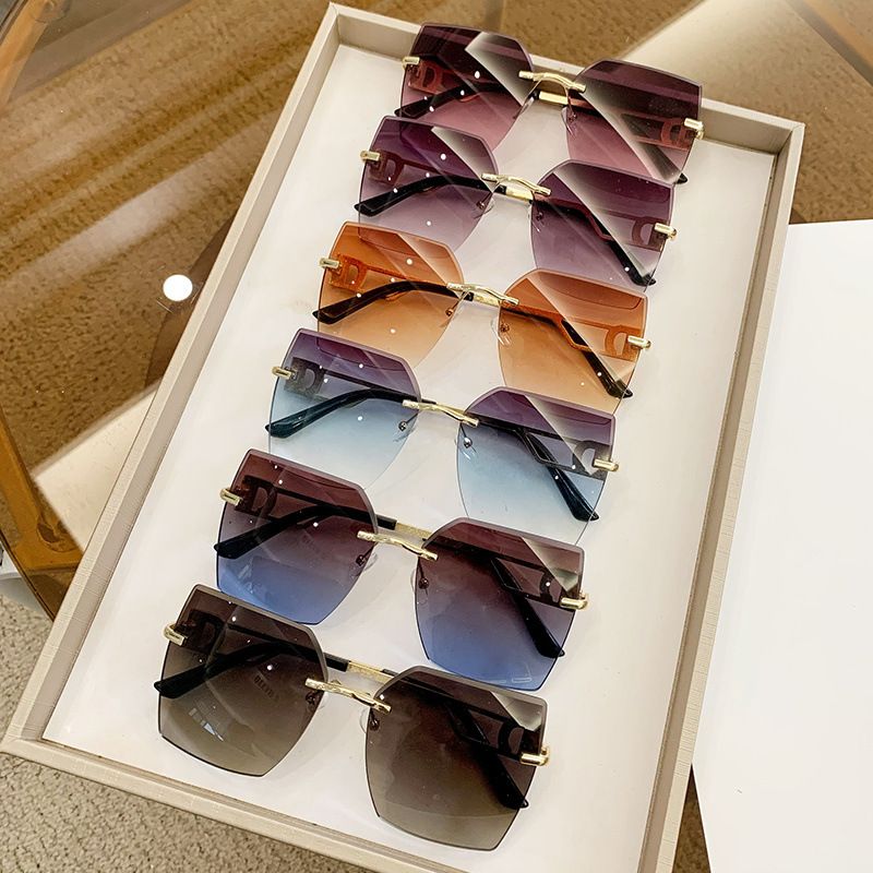 Women's trend rimless cut edge fashion driving travel glasses advanced feeling sunglasses_voghion.com