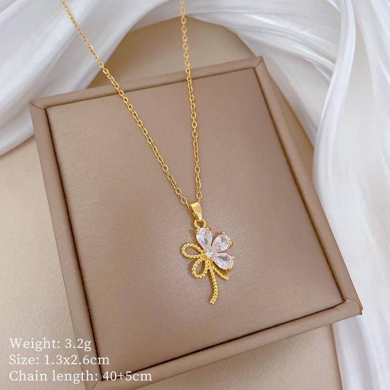 Orecchini con ciondolo a forma di fiore cavo con zirconi color oro lucido Set per le donne Set di gioielli con girocollo per ragazze dolci alla moda Gifr_voghion.com