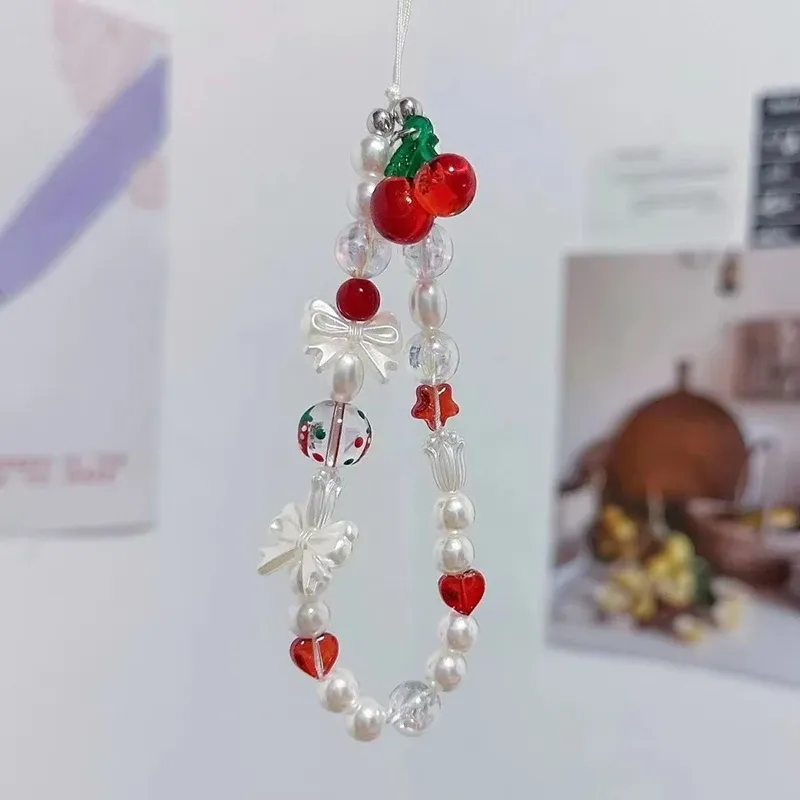Koreanische süße rote Kirsche Schleife Perle Telefon Kette Lanyard Charm Strap Handgelenk Perle hängen Schnur Armband Schlüsselanhänger für iPhone Mädchen Seil_voghion.com