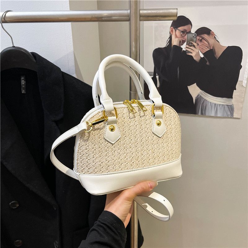 2025 New Straw Woven Shell Fashion Single Shoulder Crossbody Handheld Women's Korean Style Simple Texture Color-Block_voghion.com