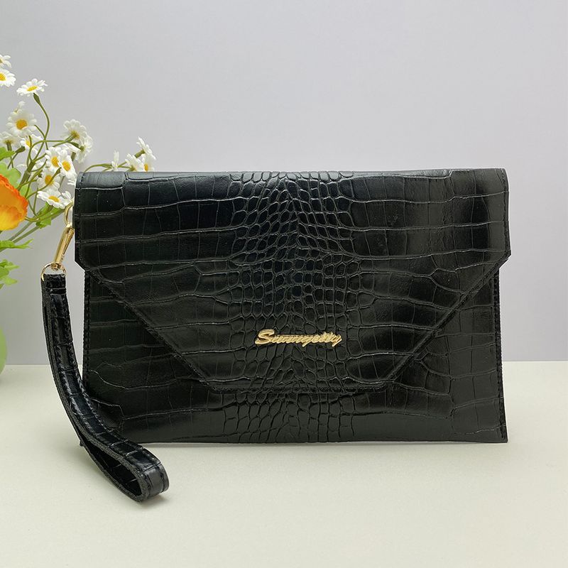 Portafoglio sottile con protezione RFID e cinturino da polso, con texture in pietra di lusso da donna_voghion.com