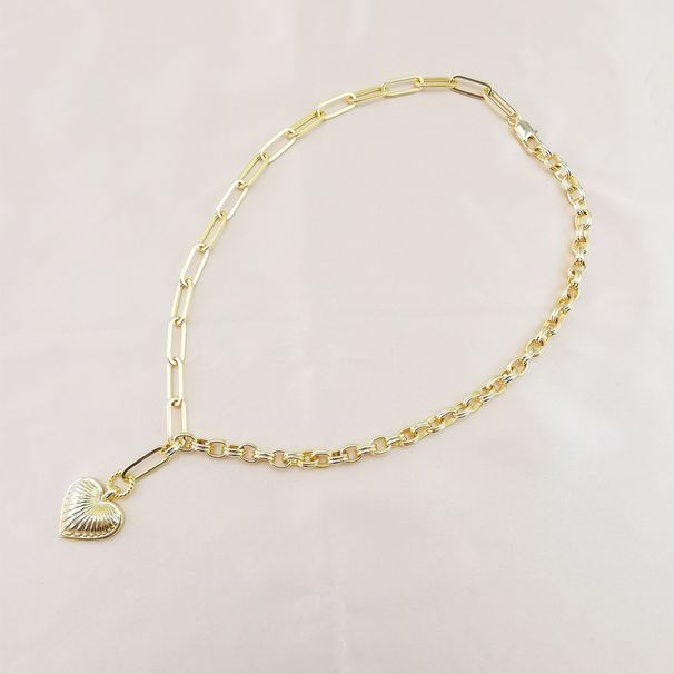Collana con ciondolo a forma di cuore asimmetrico a catena spessa placcata in vero oro e interamente in metallo ramato_voghion.com