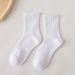 Black And White Socks Ins Style Elastic Simple Trend Solid Color Cotton Socks Mid Tube Socks Women Sports Breathable Long Socks Couple Socks_voghion.com