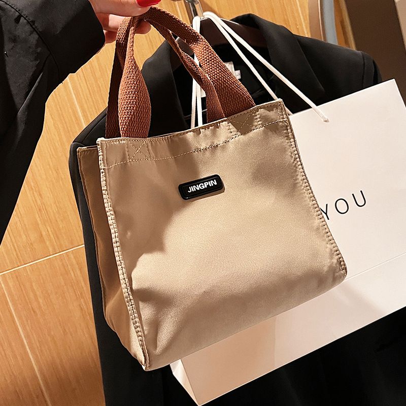 Borsa da viaggio di alta qualità per le donne, 2024, nuova, squisita, piccola borsa in tessuto per il pranzo, borsa a mano alla moda in tinta unita_voghion.com