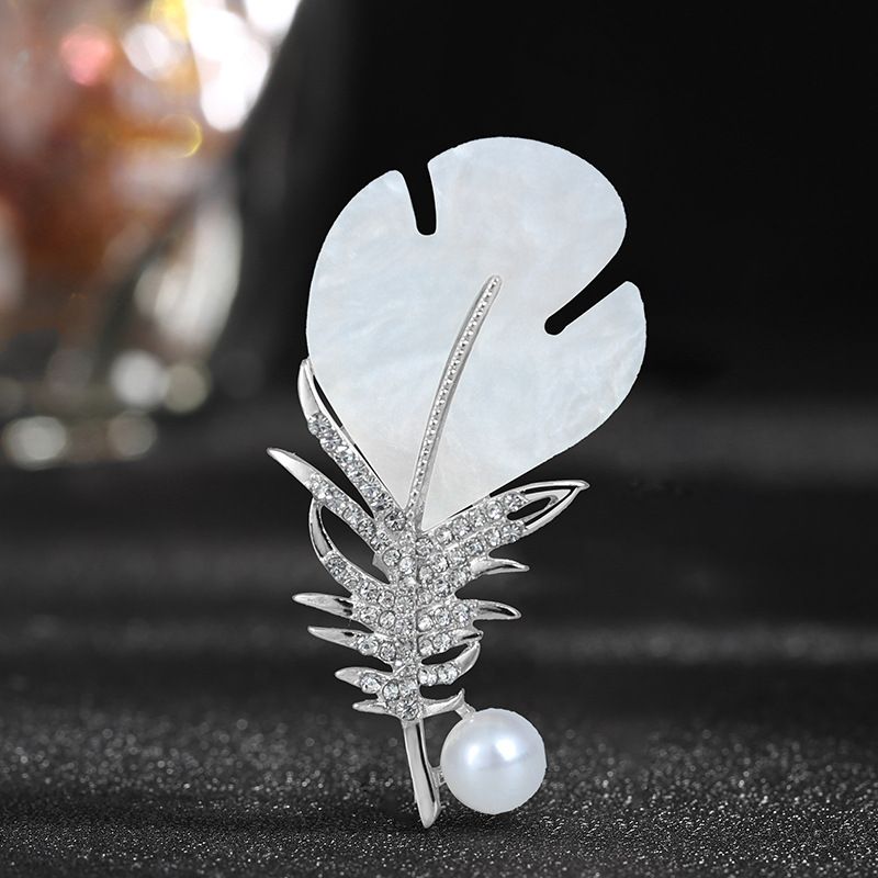 Feather brooch for women high end anti exposure corsage design niche suit fixed spot wholesale accessories pin buckle_voghion.com