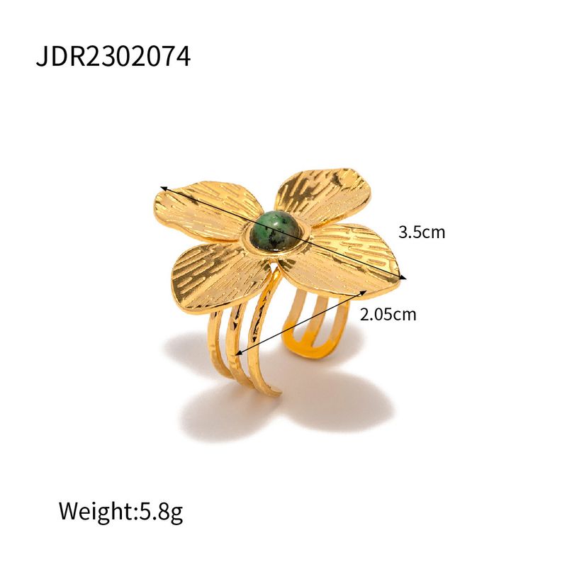 Matte vierblättrige Blume im französischen Hofstil, übertriebene Einlage mit türkisfarbenem offenem Ring, High-End-Design-Kombination_voghion.com