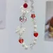 Cordino per telefono cellulare coreano con fiocco rosso ciliegia e perla, con ciondolo a forma di cordino da polso, portachiavi per iPhone, ragazza, corda_voghion.com