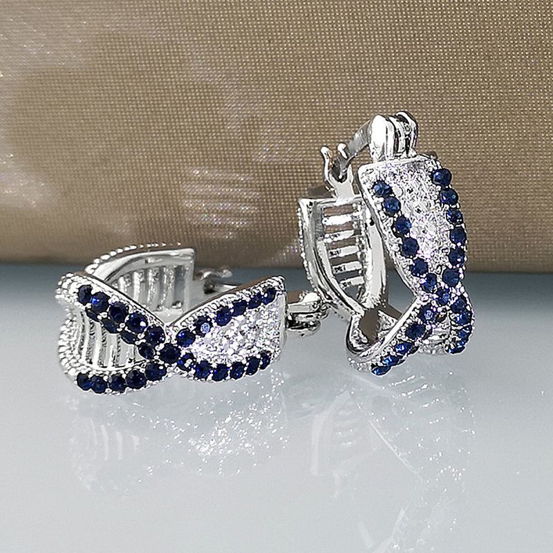 Cao Shi's Advanced Sense Treasure Blue Zircon Earrings with Korean Version Temperament and Personality Cross Hip Hop Style Earrings_voghion.com