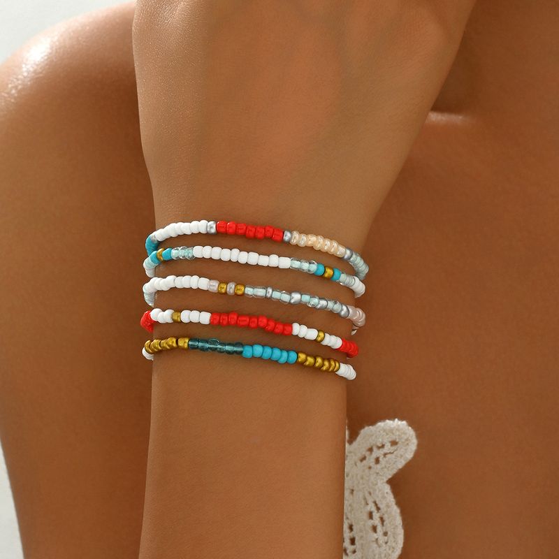 Contas femininas de estilo minimalista com contas de arroz coloridas personalizadas, design de nicho, conjunto de pulseiras de cinco peças_voghion.com