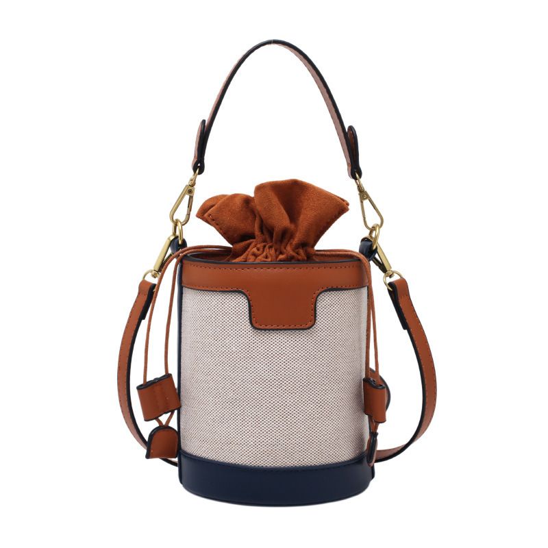 Borsa a secchiello Donna 2023 Nuova versione coreana di The Hand Carry Borsa a tracolla cilindrica Borsa a tracolla in contrasto di colore in tela retrò alla moda_voghion.com