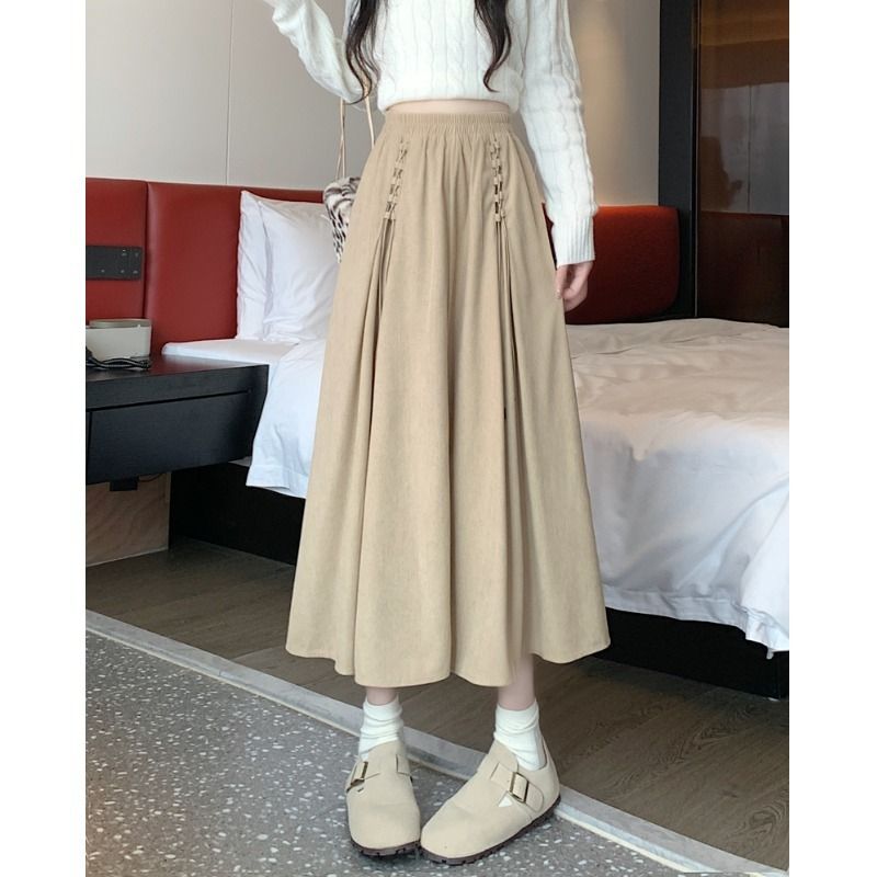 Sentido del diseño: falda midi de pana de nicho para mujer, otoño invierno 2024, cintura alta y caída, largo medio, color café_voghion.com