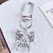 New Cool Alloy Silver Butterfly Rose Cross Key Chain Car Bag Key Pendant_voghion.com