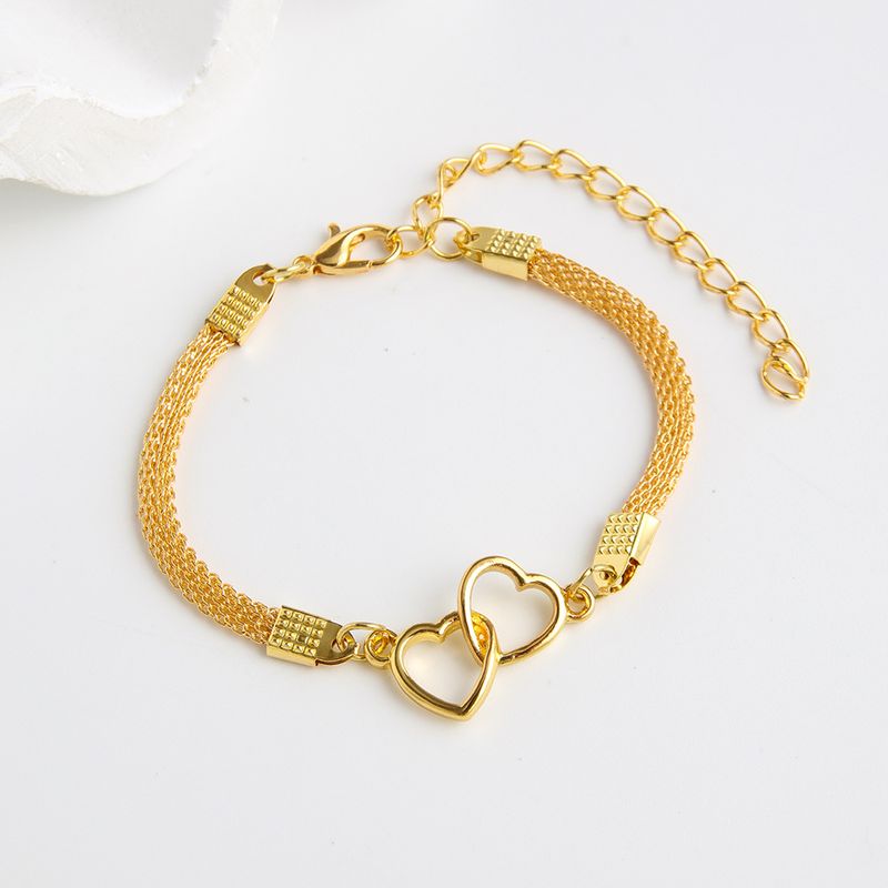 Nuovo braccialetto in argento lucido intrecciato con design creativo a doppio cuore_voghion.com