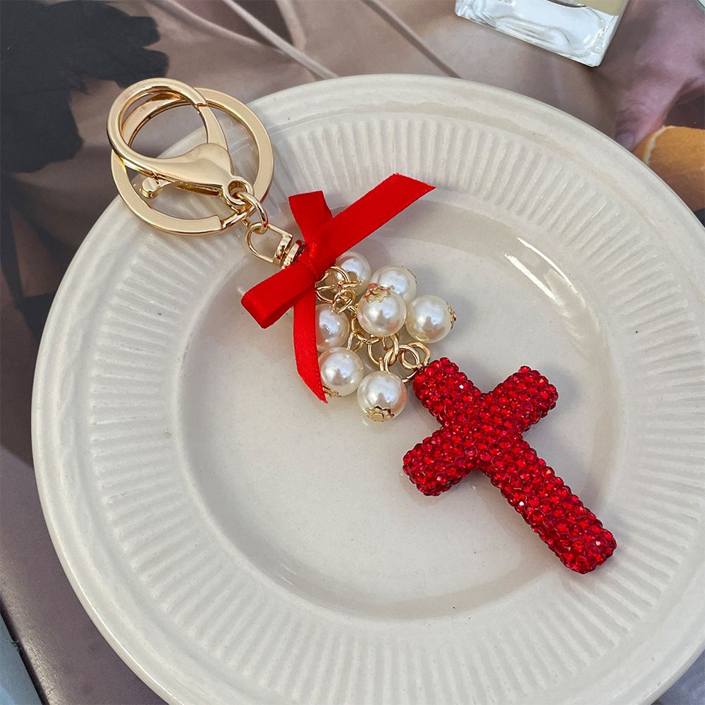 Versione coreana, squisito ciondolo portachiavi con ciondolo a forma di croce in argilla per auto e borsa, con fiocco di perle e diamanti_voghion.com