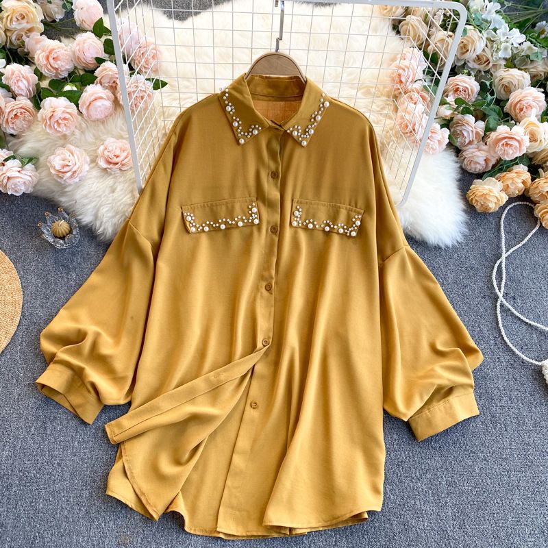 Abbigliamento donna Camicia in chiffon con maniche a sbuffo e risvolto e top con strass_voghion.com