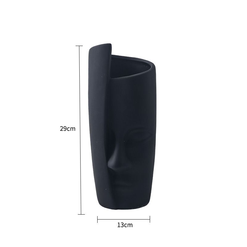 Abstraktes menschliches Gesicht, einfache Keramik, kreatives Zuhause, grünes Ornament, saftige frische Topfpflanze, Blumentopf_voghion.com