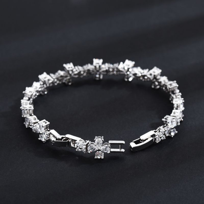 Pulsera unisex con cruz de diamantes y cadena de tenis ajustable, estilo hip hop, con incrustaciones de circonitas._voghion.com