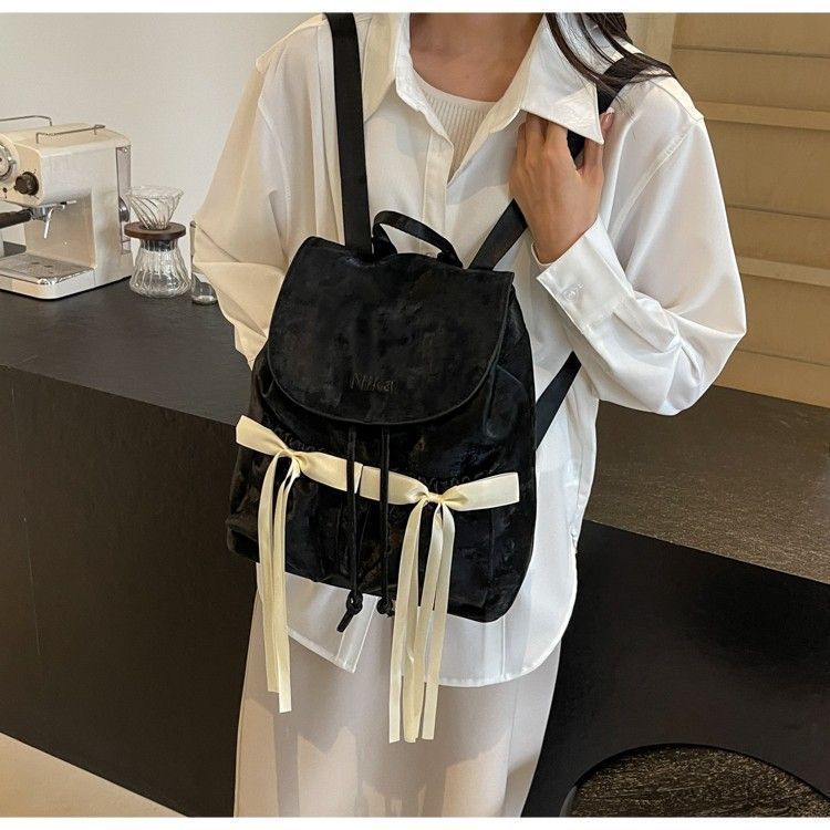 Mochila de lona com laço da moda, bolsa de viagem de grande capacidade, outono/inverno 2025, nova_voghion.com