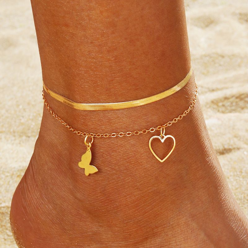 Cavigliera da donna in stile etnico retrò, con catena per piede, intarsiata a forma di farfalla e cuore, alla moda, di tendenza, con set di accessori per cavigliere da donna_voghion.com