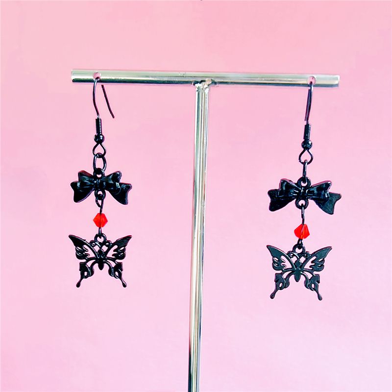 Orecchini con perline di cristallo rosso e orecchini a farfalla cavi neri_voghion.com