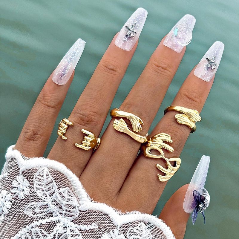 Set di quattro anelli aperti in oro con doppia mano e design alla moda, per donna_voghion.com