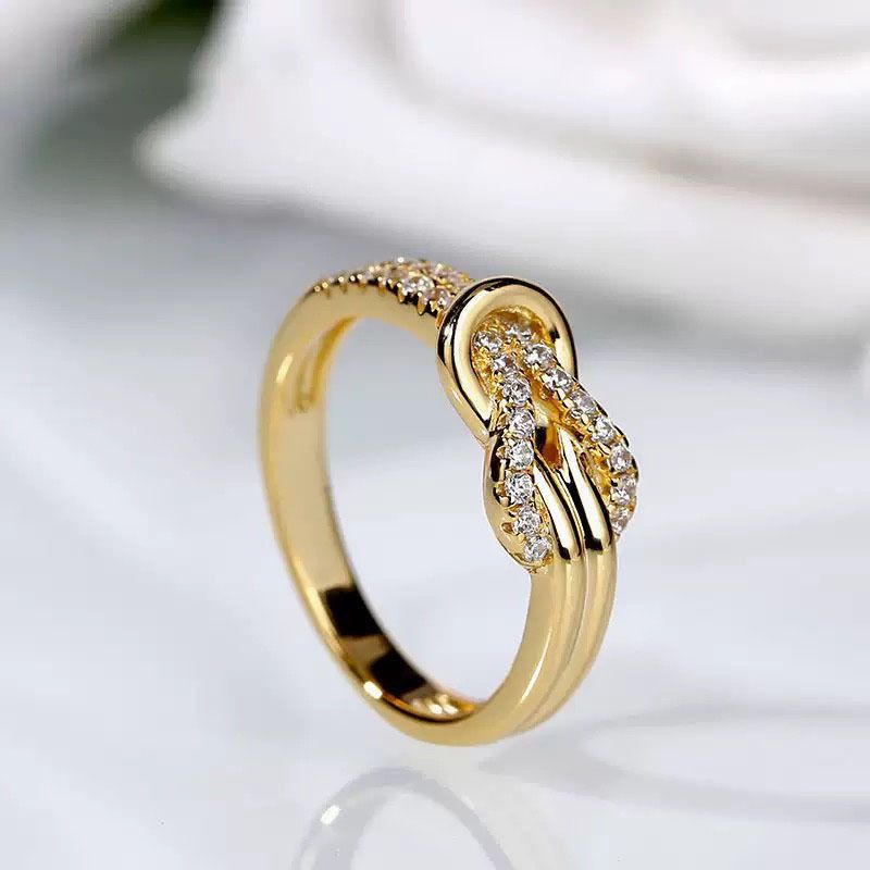 Elegante anello di fidanzamento da donna in stile coreano e giapponese con diamanti intarsiati a forma di fiore annodato_voghion.com