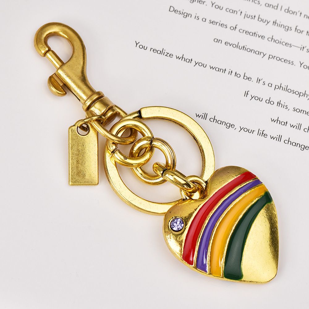 Portachiavi con ciondolo a forma di cuore con ciglia e goccia d'olio, in lega, con arcobaleno, semplice e colorato, per donna_voghion.com