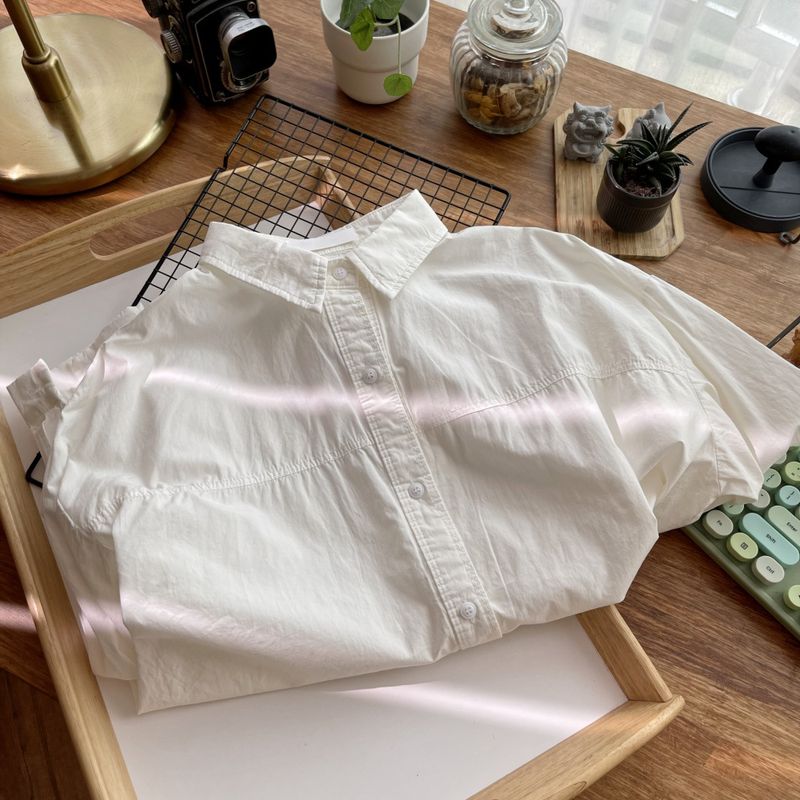 This feels so comfortable~ The back has a unique texture and is easy to match. Simple solid color loose lapel shirt for women._voghion.com