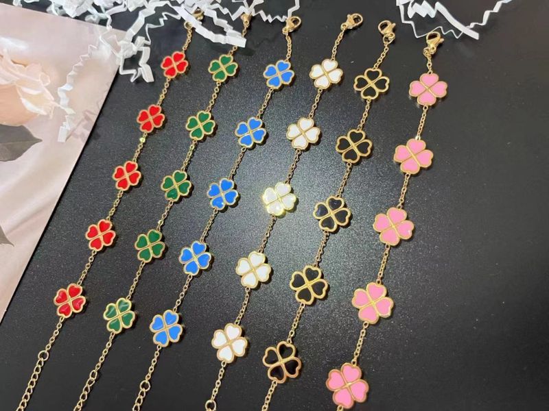 Bracelet trèfle à quatre feuilles en acier titane et or jaune pour femme_voghion.com