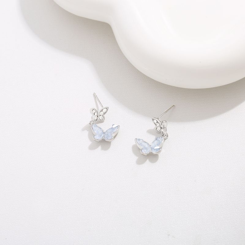 Orecchini pendenti a forma di farfalla in cristallo trasparente - Eleganti accenti in zircone, gioielli estivi di alta gamma di nicchia_voghion.com