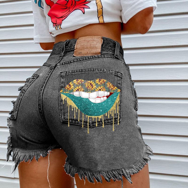 Shorts in denim da donna Shorts in denim strappati con nappe_voghion.com