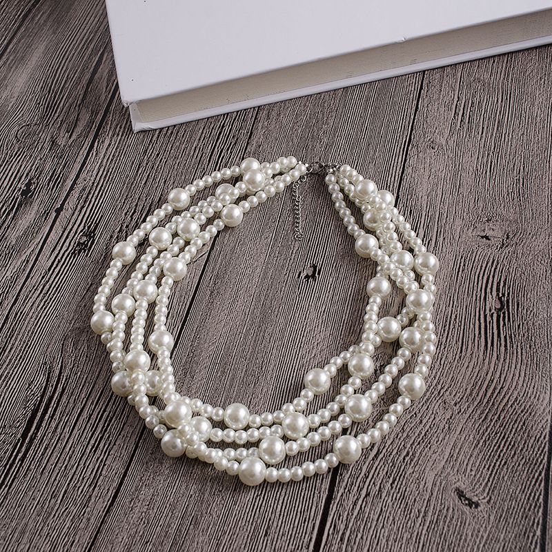 Collar de perlas de imitación multicapa con un pequeño aroma a viento, cadena única de cuatro capas y elegantes cuentas redondas._voghion.com