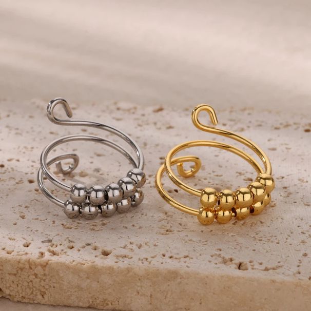 Apzeltīts stresa mazināšanas un trauksmes mazināšanas vara pērlīšu rotējošs gredzens ar atvērtām pērlītēm_voghion.com