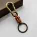 Portachiavi in vera pelle, accessori di alta qualità, con fibbia a molla in metallo, ciondolo in pelle di mucca vintage intrecciata, portachiavi 2407_voghion.com