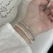 Piccolo squisito zircone zolletta di zucchero Shijia braccialetto elastico di perle leggero lusso francese elegante braccialetto ragazze gioielli all'ingrosso_voghion.com