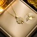 collana con pendente creativo a forma di trifoglio apribile, le ali dell'amore alla moda possono essere incise sulla clavicola delle donne_voghion.com
