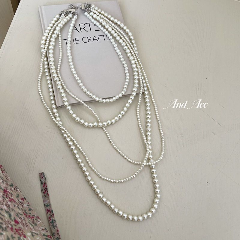 Collana di perle di vetro multistrato, stile alla moda, con catene a nicchie impilate per le donne, per l'autunno e_voghion.com