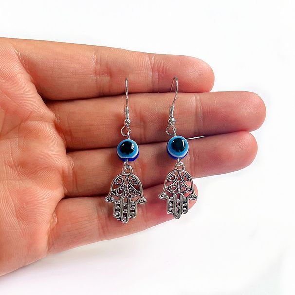 Orecchini vintage con ciondolo a forma di mano e occhio_voghion.com