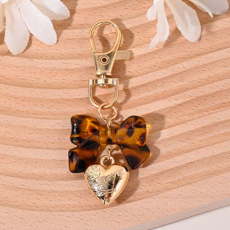 New Fashion Cute Leopard Print Bowknot Chrysanthemum Letter Tassel Keychain Bag Pendant_voghion.com