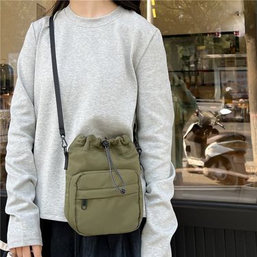 Folded drawstring bag, nylon shoulder bag, fashionable and niche crossbody bag, casual and versatile phone bag_voghion.com