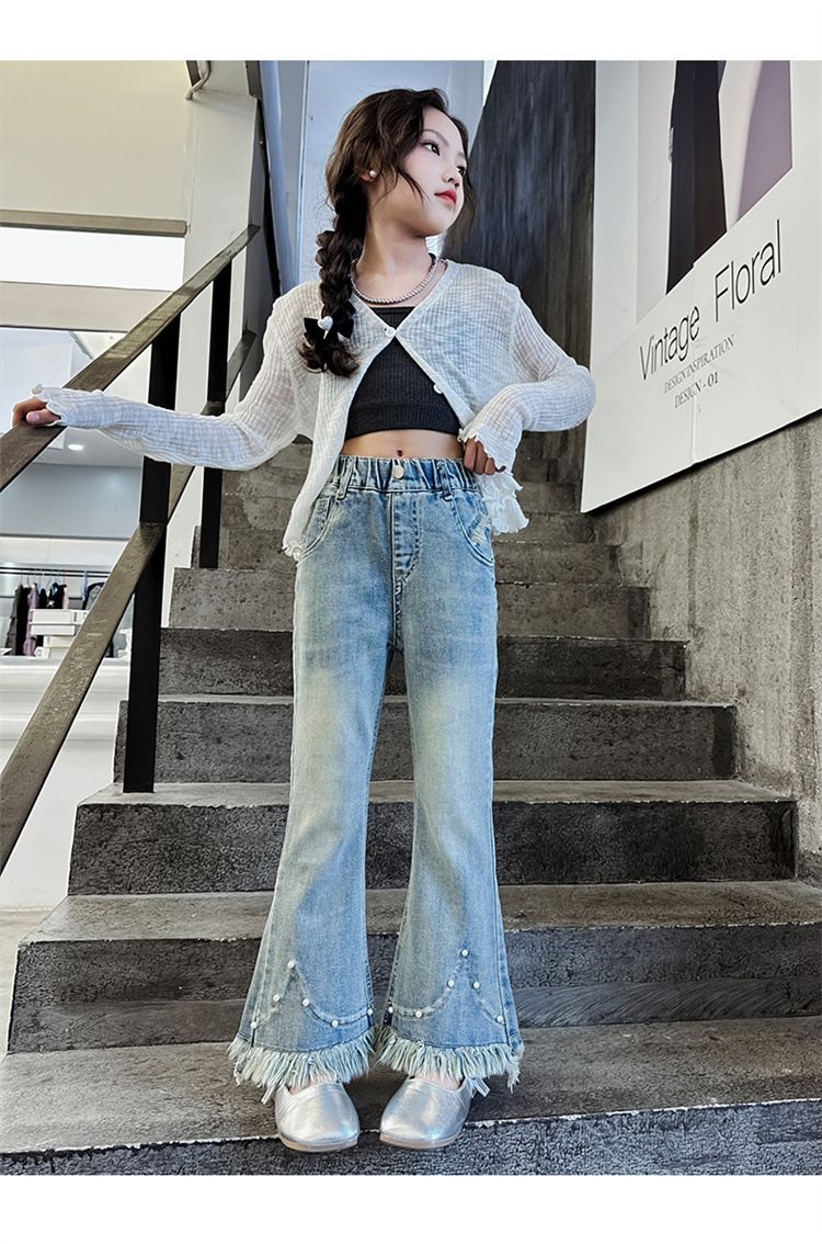 Ropa para niños Niñas 2024 primavera y otoño nuevos modelos para niñas medianas y grandes elegantes pantalones acampanados de mezclilla con borde sin rematar con borlas de perlas_voghion.com