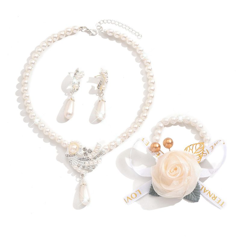 Set di gioielli da donna alla moda, collana di perle, orecchini, bracciale, set di fiori in lega, abito da sposa, personalità, temperamento alla moda femminile_voghion.com