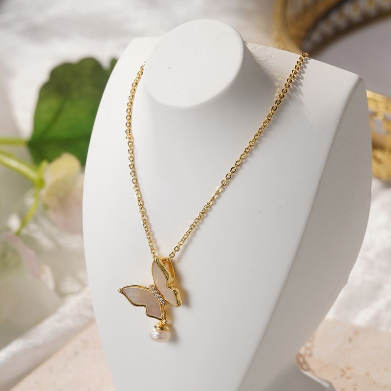 Collana elegante e versatile da donna, con ciondolo a forma di farfalla, in stile retrò francese, con zirconi intarsiati e fiore a quattro foglie._voghion.com